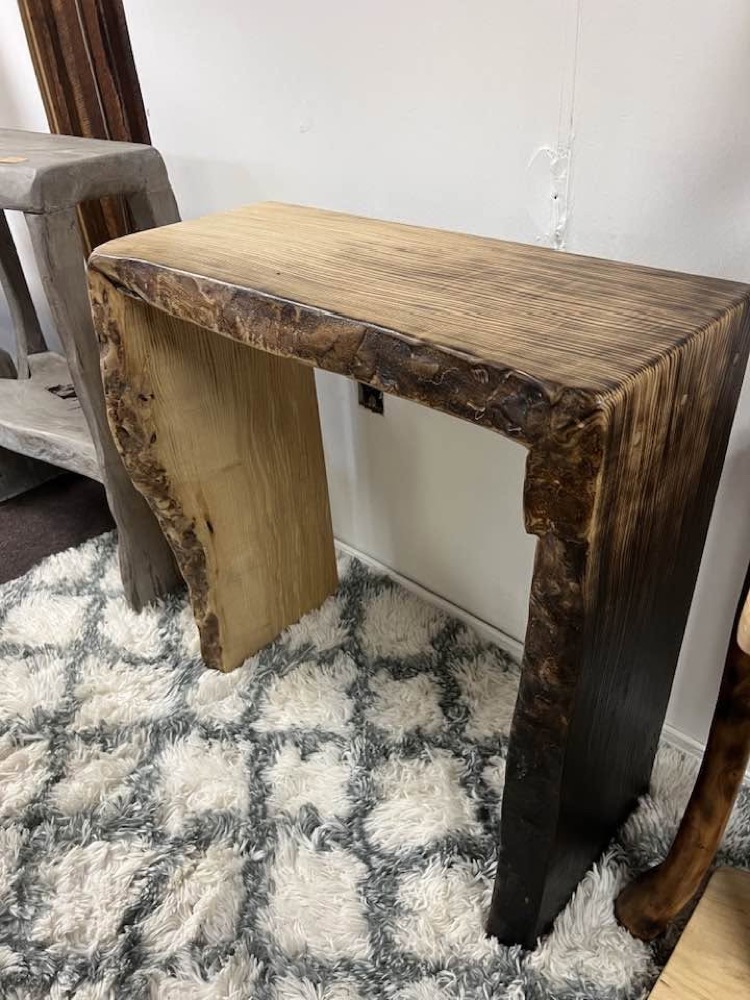 Live-edge console table with a rich burl top